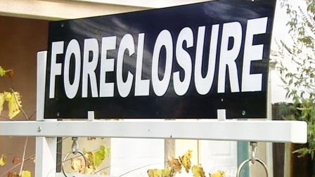 A foreclosure sign is shown in front of a home in this undated file photo.