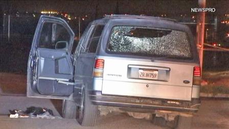 The back window of a van is seen after an alleged exchange of gunfire between the driver and deputies in Highland on Monday, Dec. 31, 2012. The driver was hospitalized and is expected to survive. He is facing charges.