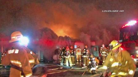 Firefighters are seen battling a fire at a storage facility in Gardena on Sunday, Feb. 17, 2013.