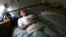 A woman is seen sleeping in this undated file photo.