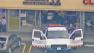 A tow truck is seen preparing to haul a car out of a bakery in Glendale on Thursday, March 28, 2013. One person died in the crash, apparently caused by an elderly driver. The crash was under investigation.