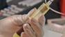 A doctor is seen examining blood from the FM test, a new test that helps diagnose fibromyalgia.