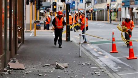 Workers are seen in the streets of New Zealand following a 6.8-magnitude earthquake Friday, Aug. 16, 2013.