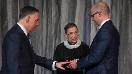Supreme Court Justice Ruth Bader Ginsburg officiates at the wedding of Kennedy Center President Michael Kaiser (left) and government economist John Roberts (right) at the Kennedy Center for the Performing Arts on Saturday, Aug. 31, 2013.