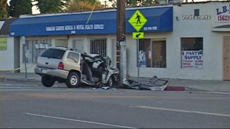 A car is seen after it was shot at and crashed into a telephone pole in Hawaiian Gardens on Saturday, Aug. 31, 2013.