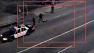 A still from surveillance shows a woman in the street after she fell or jumped from an LAPD patrol car in March 2013.