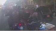 Video footage shows a confrontation between a group of bikers and an SUV in New York City on Sunday, Sept. 29, 2013.