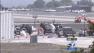 Authorities investigate the wreckage of a plane crash at Santa Monica Airport on Tuesday, Oct. 1, 2013.