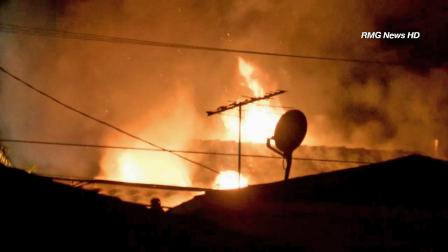 A home on the 200 block of Markland Drive in Monterey Park is seen in flames Sunday, Oct. 6, 2013.