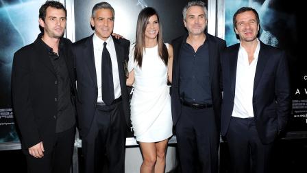 Screenwriter Jonas Cuaron, left, actor George Clooney, actress Sandra Bullock, director Alfonso Cuaron and producer David Heyman pose together at the premiere of Gravity at the AMC Lincoln Square Theaters on Tuesday, Oct. 1, 2013 in New York.