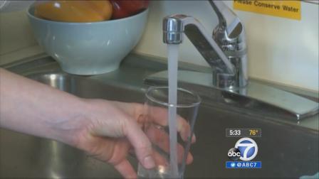 A person gets water from the sink in this undated file photo.