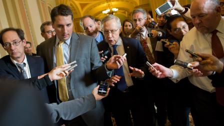Senate Majority Leader Sen. Harry Reid, D-Nev., is surrounded by reporters after leaving the office of Senate Minority Leader Sen. Mitch McConnell, R-Ken., on Capitol Hill on Monday, Oct. 14, 2013 in Washington.