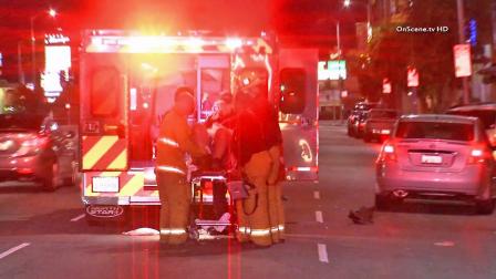 First responders load a man into an ambulance after he was struck by a car in South Robertson on Friday, Nov. 29, 2013. The man is expected to be OK.