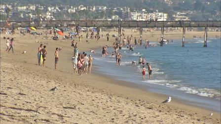 People are seen at the beach in this undated file photo.