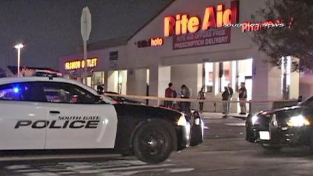 Authorities investigate a shooting at Rite Aid in South Gate on Sunday, Feb. 9, 2014.