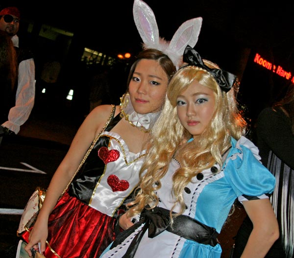 Revelers in 'Alice in Wonderland' theme at the...