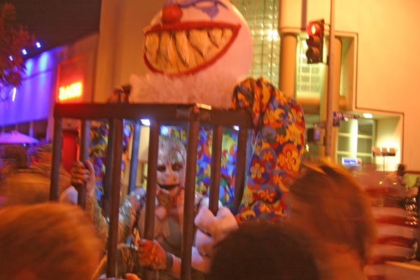 A caged clown at the West Hollywood Halloween...