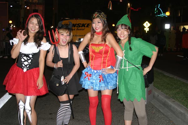 Revelers stop to pose for a picture during the West Hollywood Halloween Costume Carnaval in West Hollywood on Wednesday, Oct. 31, 2012.