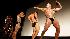 Contestants compete in a bodybuilding competition held in the Acapulco cinema in Havana