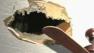 This is the hole that an alleged thief fell through during a police investigation at a home in Lawton, Oklahoma.
