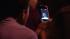 A spectator captures the fireworks display with...
