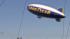 The Goodyear Blimp is seen flying in this photo....