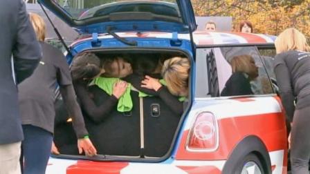 Twenty-eight women crammed into a Mini Cooper, setting a new Guinness World Record.