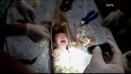 Chinese firefighters rescued a newborn boy from a sewer pipe in Zhejiang province in eastern China on Saturday, May 25, 2013.