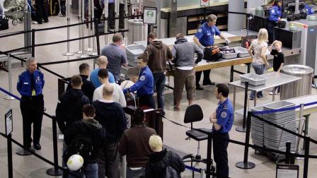 Airline passengers line up at the TSA security check at Minneapolis-St. Paul International Airport Monday, March 30, 2009 in Minneapolis, Minn.