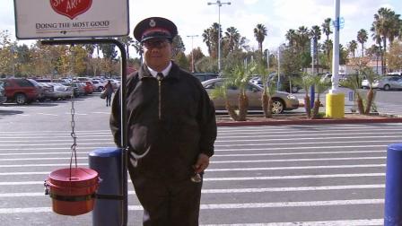 Salvation Army Maj. Butch Soriano is seen ringing a bell outside a store in Colton on Saturday, Dec. 7, 2013.