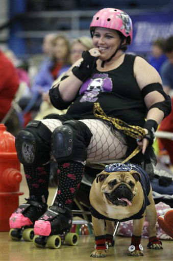 Leanne Sergio, of Ankeny, Iowa, sits with her dog Mya during the 33rd annual Drake Relays Beautiful Bulldog Contest Monday, April 23, 2012, in Des Moines, Iowa.