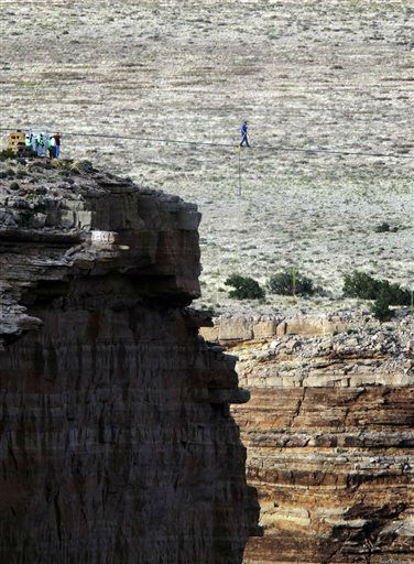 Daredevil Nik Wallenda crosses a tightrope 1,500...