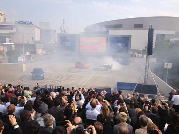 Spectators take in a Ford demonstration at the...