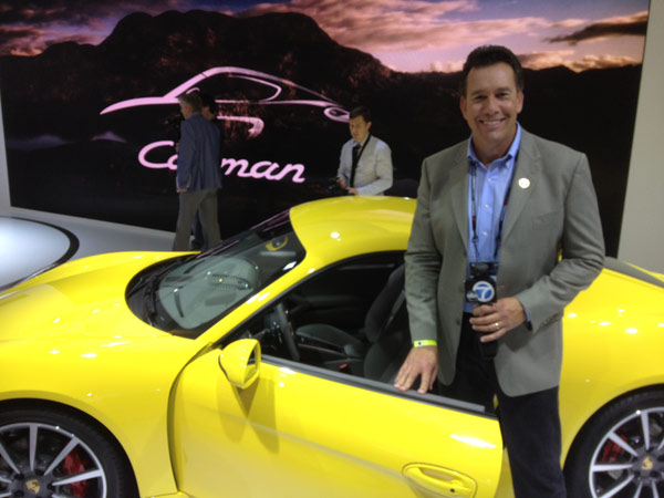 Eyewitness News automotive specialist Dave Kunz with a Porsche on display at the 2012 Los Angeles Auto Show held at the Los Angeles Convention Center downtown on Wednesday, Nov. 28, 2012.