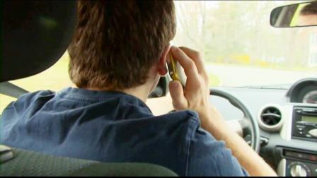 A distracted driver is seen in this undated file photo.
