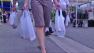 A shopper is seen carrying plastic bags in this undated file photo.