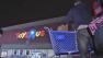 Tommy Velasquez, visiting from Seattle, Wash., loads items onto his car from the Toys R Us in Atwater Village on Monday, Dec. 24, 2012.