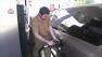 A man is seen pumping gas into his car in this undated file photo.