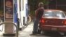 A man pumps gas at a gas station in Pasadena on Saturday, Feb. 16, 2013.