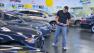 A man checks out used cars in a showroom in this undated file photo.