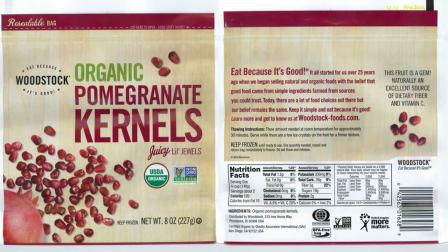 The label for Woodstock Frozen Organic Pomegranate Kernels is seen.