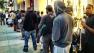 People wait in line for the release of the new iPhone 5S and 5C in Pasadena on Friday, Sept. 20, 2013.