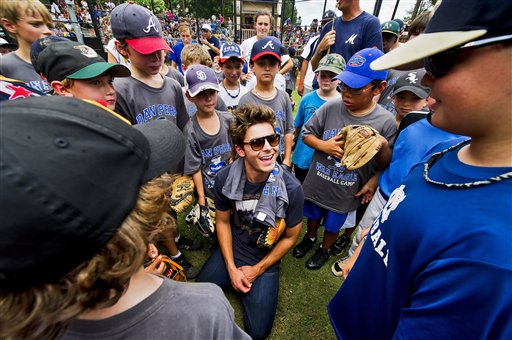 Fans gather to meet actor Zac Efron as he...