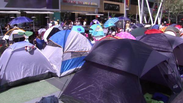Fans pitch tents of all shapes and sizes to camp out in Downtown L.A.