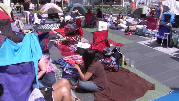 More fans camp outside, eager for the premiere.