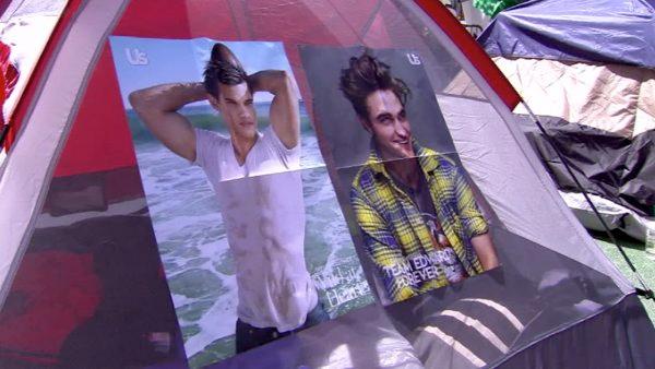 Rival characters, Jacob and Edward, hang peacefully outside a tent in poster form.