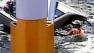 A surveillance camera captured a dramatic rescue after a womans car veered off a bridge and fell nose down into a pond.