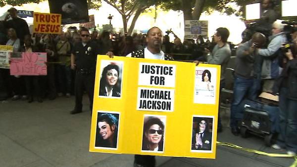 Michael Jackson fans stand outside the downtown Los Angeles courtroom where the pop singer's doctor, Conrad Murray, was convicted of involuntary manslaughter in Jackson's death on Monday, Nov. 7, 2011.