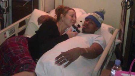 Mariah Carey is seen sharing a hospital bed with husband Nick Cannon, who is reportedly suffering from a kidney illness, according to the singers Twitter account.