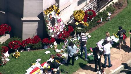 Michael Jackson fans gather for the third anniversary of the singers death outside the mausoleum where Jackson is buried in Forest Lawn Cemetery in Los Angeles on Monday, June 25, 2012.